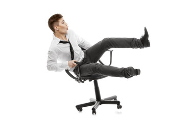 Young man rolling on chair