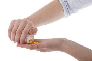 Hands holding vitamins