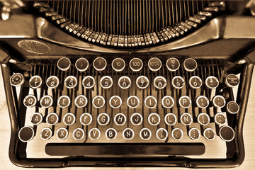 Antique typewriter on sepia