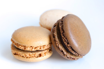 Three chocolate macaroons detail isolated on white
