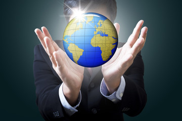 Businessman holding globe