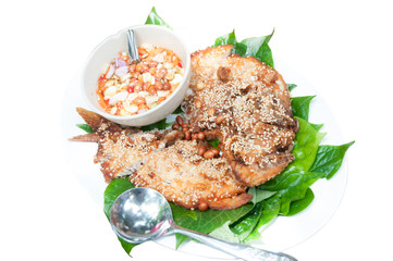 food wrapped in leaves and fired fish in isolated background