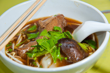 Asian cuisine, rice noodles in white bowl