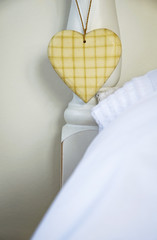 love heart hanging on bed post