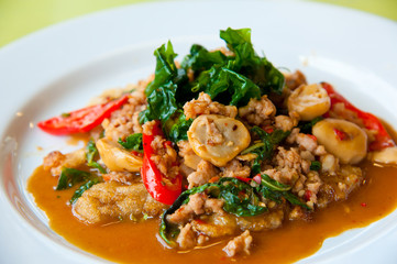 delicious fried pork, onion, chili, vegetables and green herbs