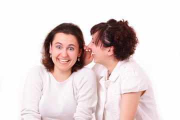 Two beautiful young girls talk