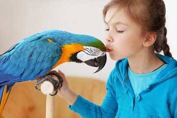 Child with ara parrot © Alena Ozerova