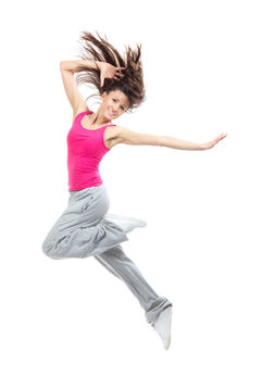 Modern teenage girl dancer jumping and dancing