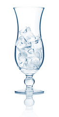 Highball cocktail glass full of ice cubes isolated