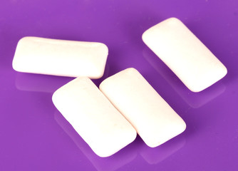 Chewing gums on purple background