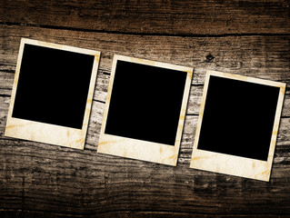 Grunge vintage photo frames on a wood