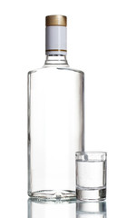 Bottle of vodka and wineglass isolated on white