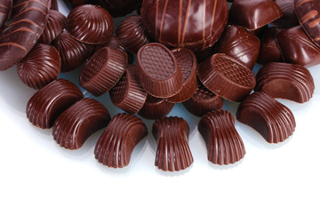 Many different chocolate candy isolated on white