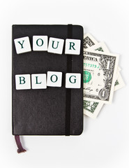 black notepad with your blog message and dollars