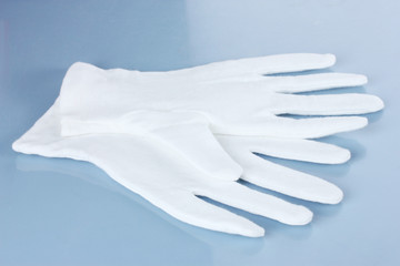 cloth gloves on blue background.