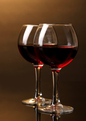 Wineglasses on brown background