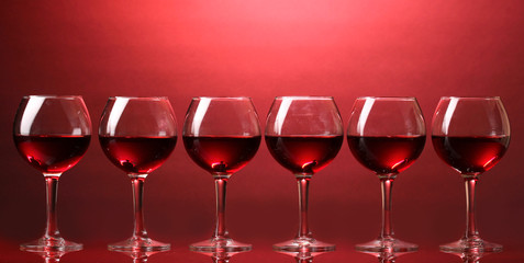 Wineglasses on red background