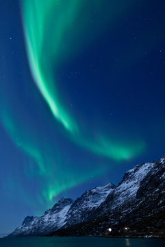 Aurora Borealis above mountains in Norway