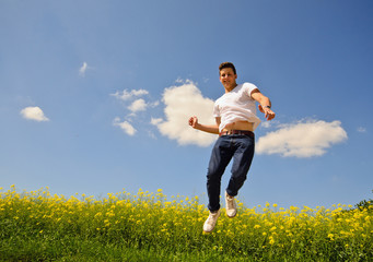 Energetic, young businessman jumping in air, great success © doris oberfrank-list