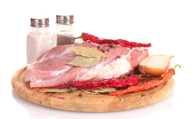 Raw meat and vegetables on a wooden board isolated on whitе