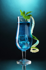 Blue cocktail in glasses on blue background