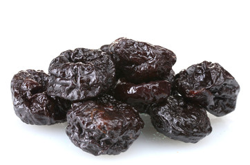 yummy dried plums isolated on white