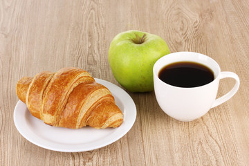 Classical breakfast. Coffee and croissant