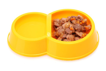 yellow bowl with cat food and water isolated on white