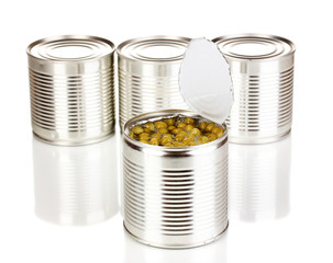 Open tin can of peas and closed cans isolated on white