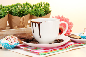 dirty cup of coffee and gerbera  beans, cinnamon sticks