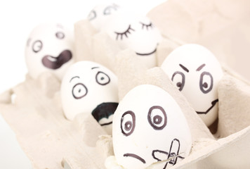 White eggs with funny faces