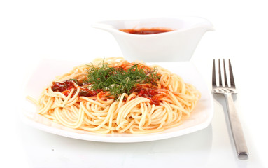 Italian spagetti cooked in a white plate with tomato sauce