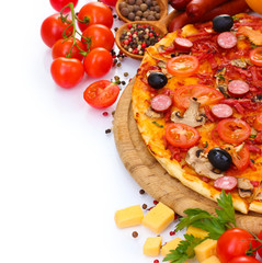 delicious pizza, vegetables and salami isolated on white.