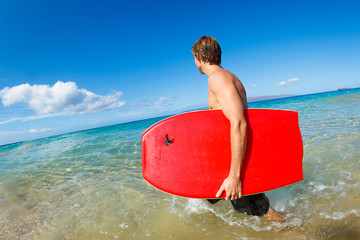 Young Man with Boogie Board at the Beach