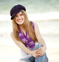 Funny teen girl near the sea.