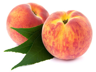 two peach fruits isolated on white background