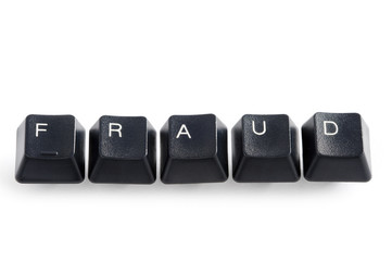 computer keys spelling the word fraud on white