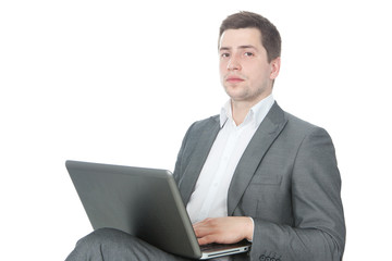 Portrait of young success businessman with laptop