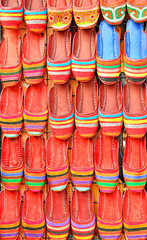 colouns of red handmade shoes