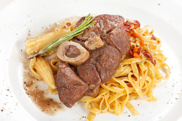tasty steak with pasta
