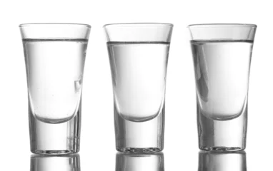 Acrylic prints Alcohol Three glass of vodka isolated on white
