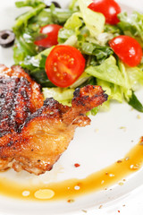 Roasted chicken leg with salad