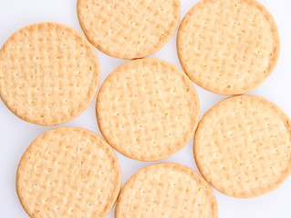 A few round biscuits on a grey background