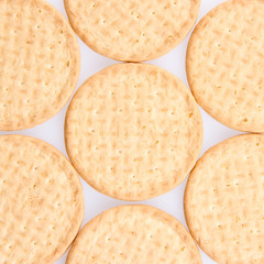 A few round biscuits on a grey background