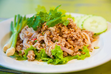 Larb chicken salad.Thai food with chicken, lime, chili, herbs