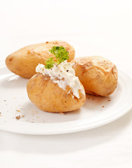 Baked potato filled with soft cheese