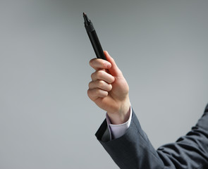 Businessman pointing with a pen