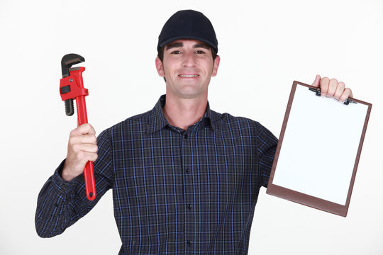 Plumber holding wrench and clip board