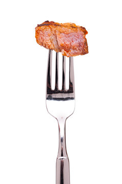 Gegrillter Schweinhals auf einer Gabel
