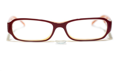 Fototapeta premium Glasses with a contact lens isolated on white